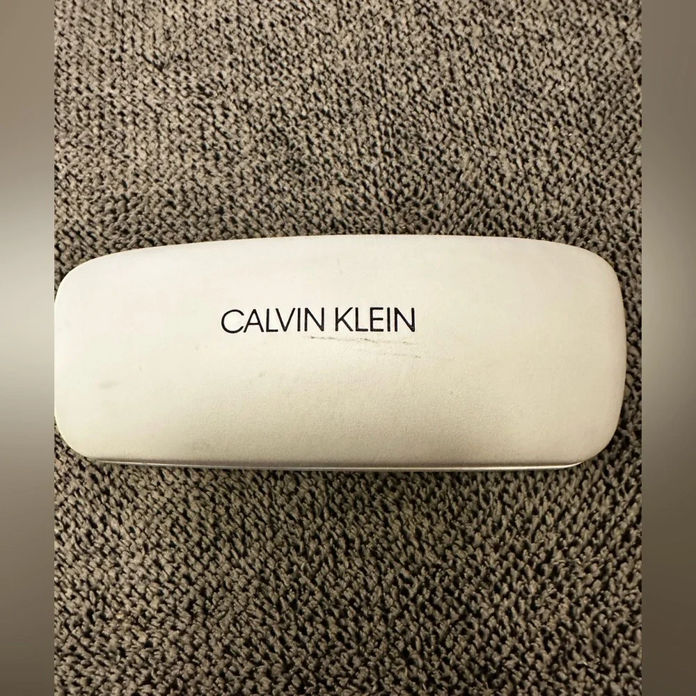Calvin Klein youth eyeglasses and case.